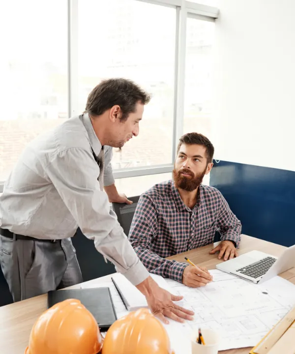 ADU consultation and planning meeting with Los Angeles ADU builders reviewing backyard project plans