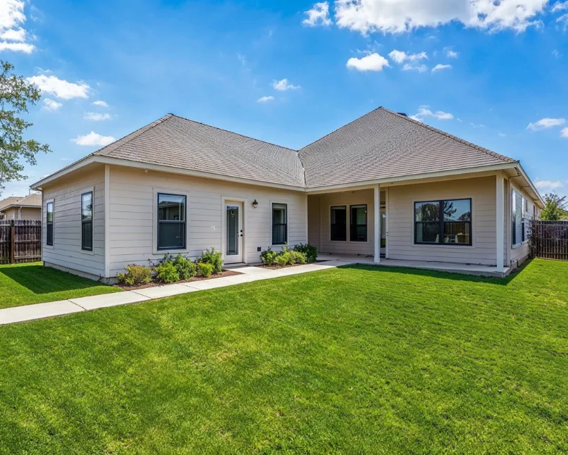 Backyard ADU remodeling and conversion project in Los Angeles featuring updated siding, windows, and covered patio area