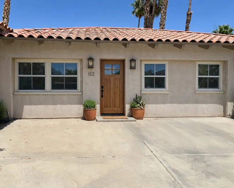 Junior ADU conversion in Los Angeles showing a small backyard living unit with stucco exterior, modern windows, and private entrance